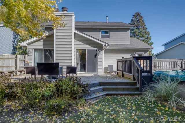 a view of a house with a fountain and a yard