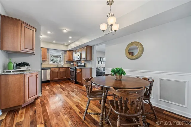a view of a dining room with furniture and a clock
