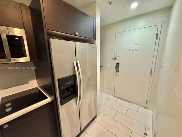 a bathroom with a glass door shower and a sink
