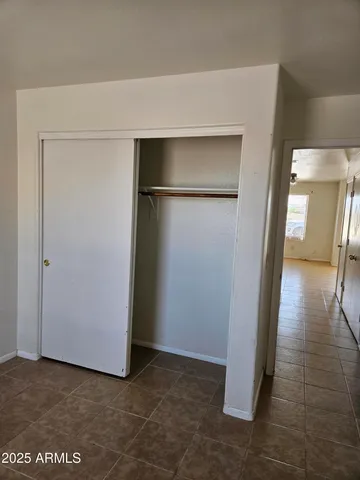 a view of a hallway with closet