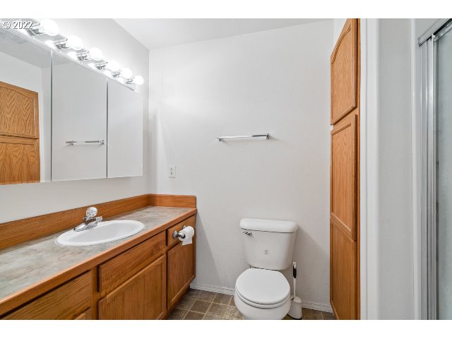335 Jason Avenue Stanfield, OR 97875 - Photo 22 of 28 a bathroom with a granite countertop sink toilet and shower