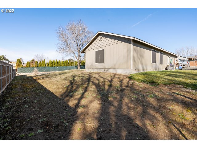 335 Jason Avenue Stanfield, OR 97875 - Photo 28 of 28 a view of an house with backyard and trees