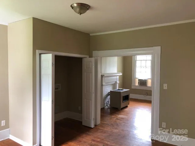 a view of a living room with a wooden floor