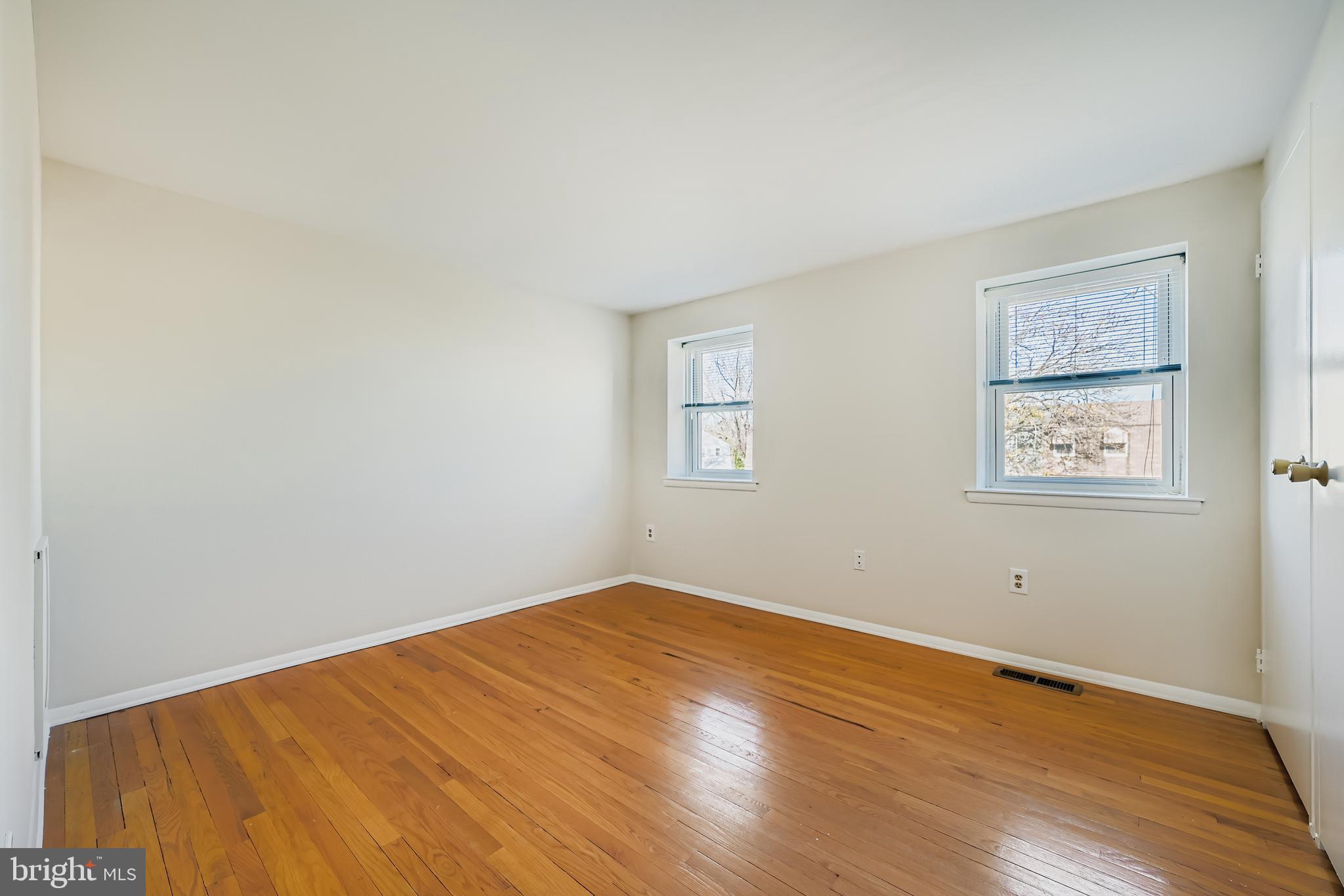 658 Kingston Road Baltimore, MD 21220 - Photo 15 of 28 a view of empty room with wooden floor