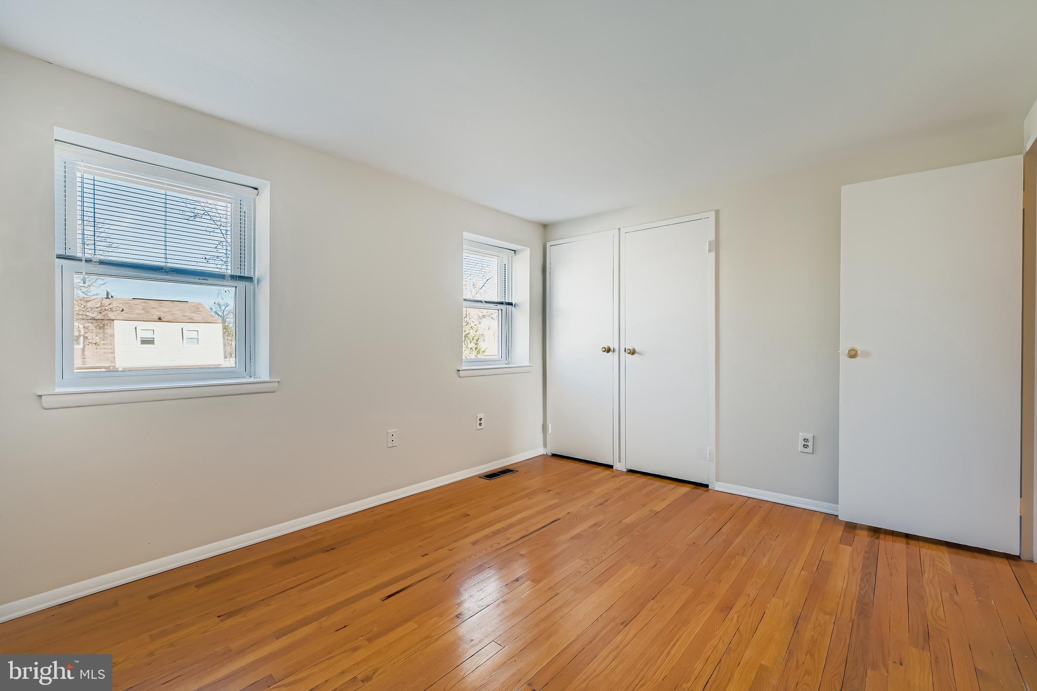 658 Kingston Road Baltimore, MD 21220 - Photo 16 of 28 a view of empty room with wooden floor and fan
