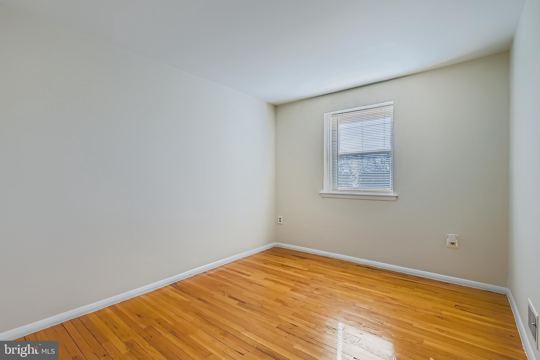 658 Kingston Road Baltimore, MD 21220 - Photo 20 of 28 a view of empty room with wooden floor