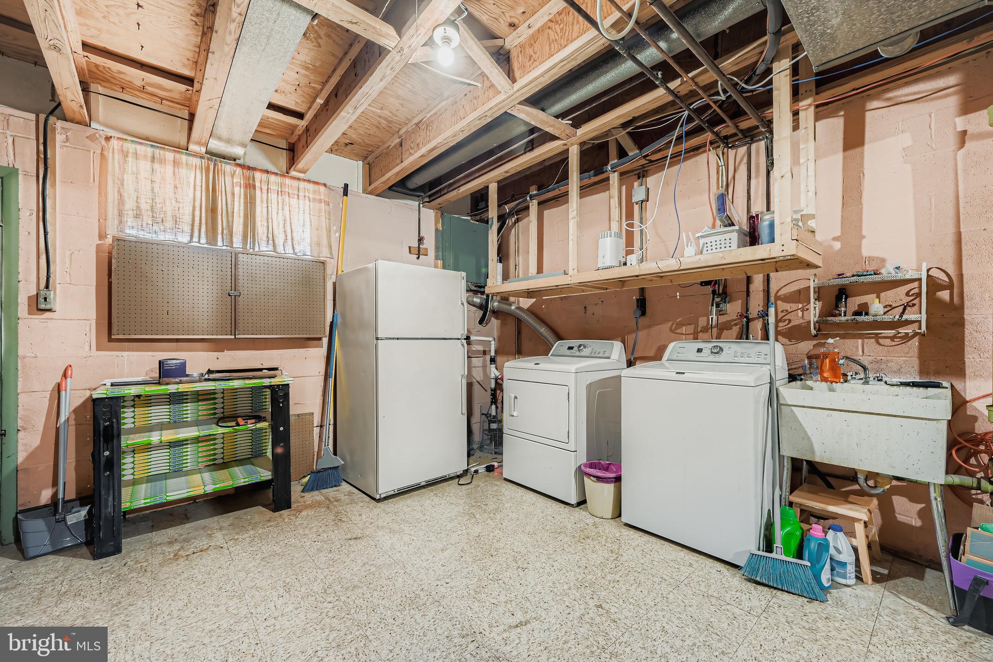 658 Kingston Road Baltimore, MD 21220 - Photo 24 of 28 a utility room with dryer and washer