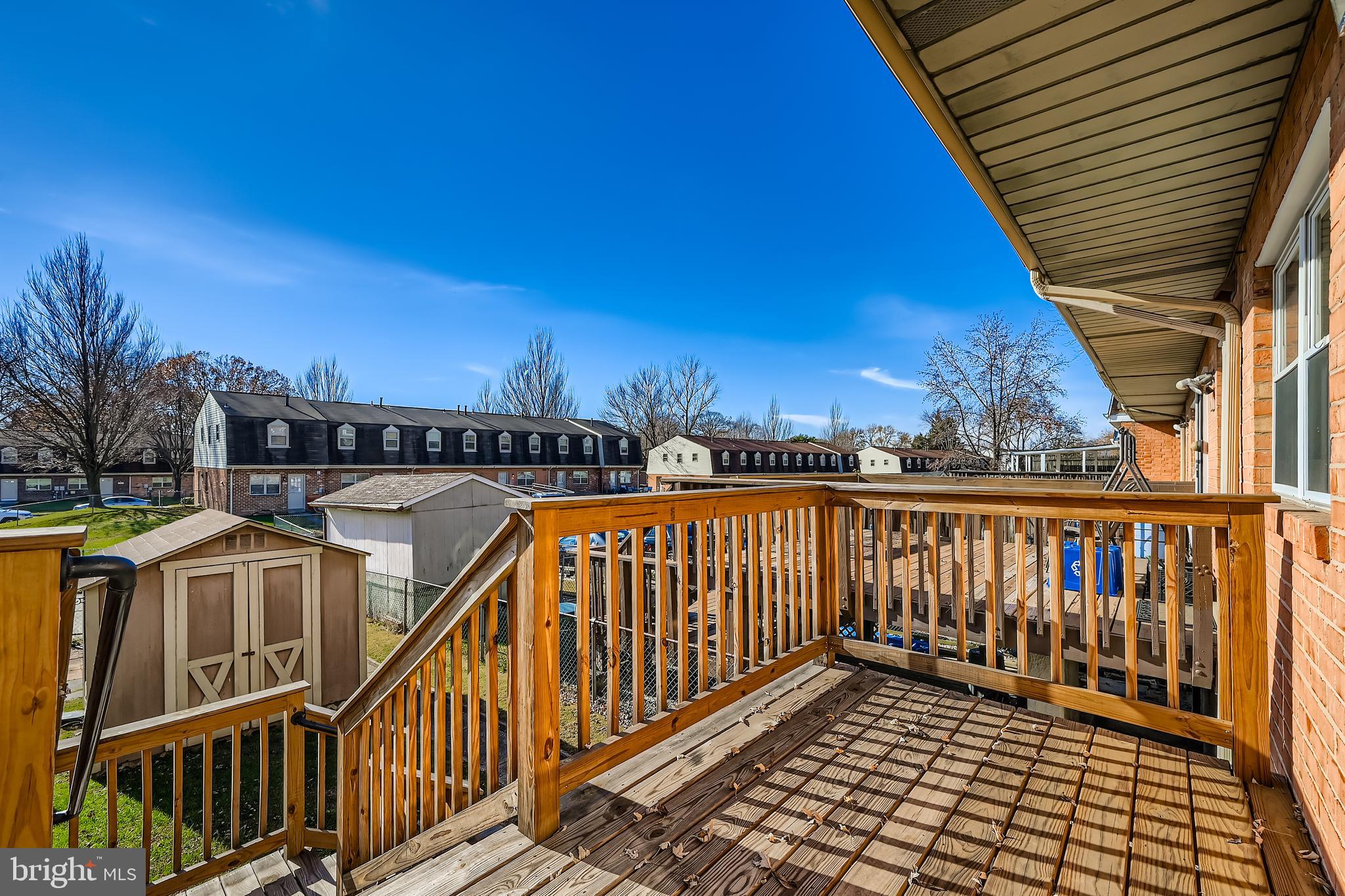 658 Kingston Road Baltimore, MD 21220 - Photo 25 of 28 a view of a balcony with wooden fence