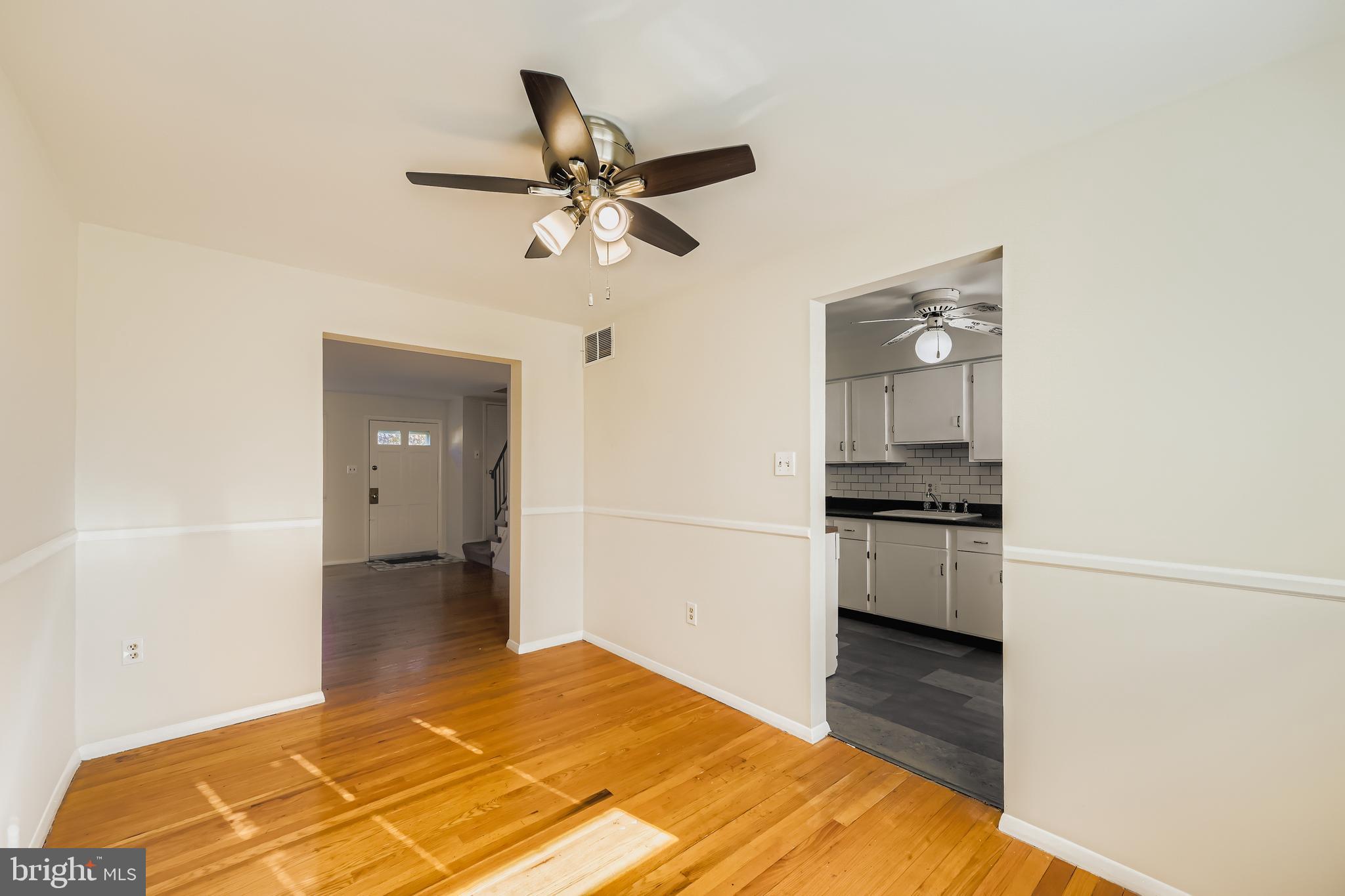 658 Kingston Road Baltimore, MD 21220 - Photo 10 of 28 a bedroom with a bed and a view of kitchen