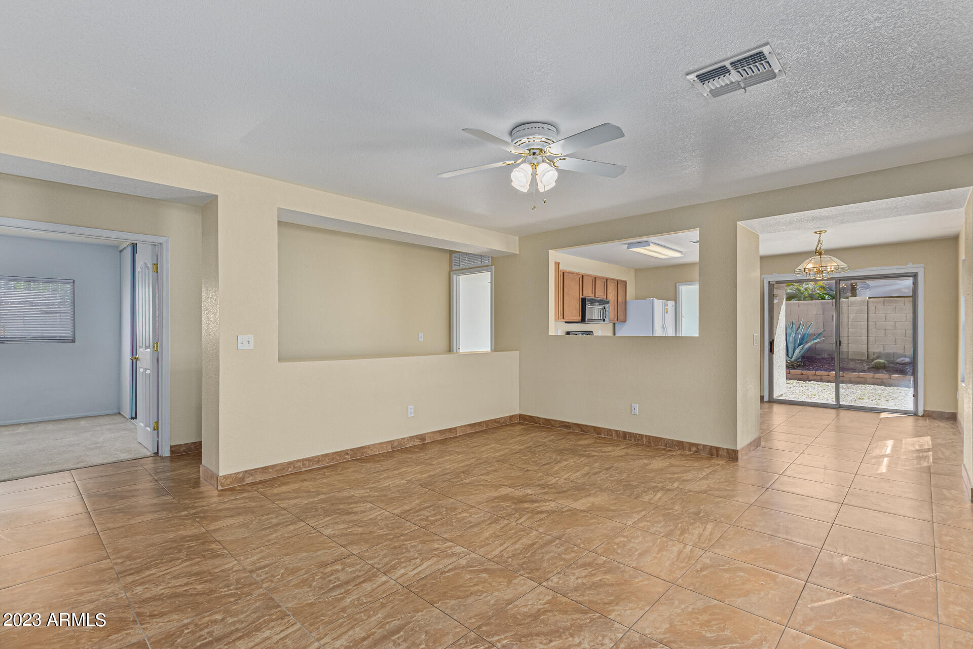 3383 South Chaparral Road Apache Junction, AZ 85119 - Photo 2 of 25 a view of an empty room with a window
