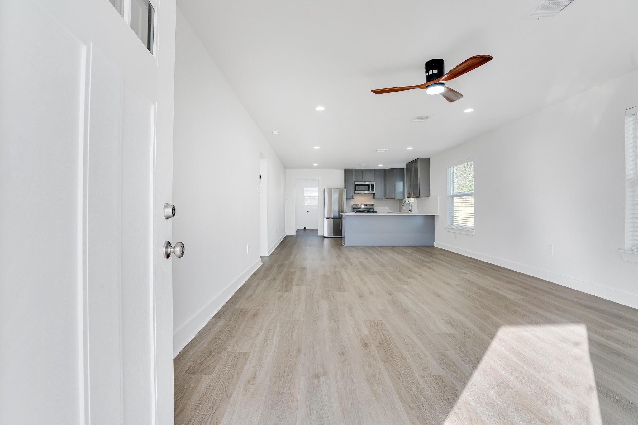6123 Tuskegee Street Houston, TX 77091 - Photo 3 of 13 a view of empty room with wooden floor