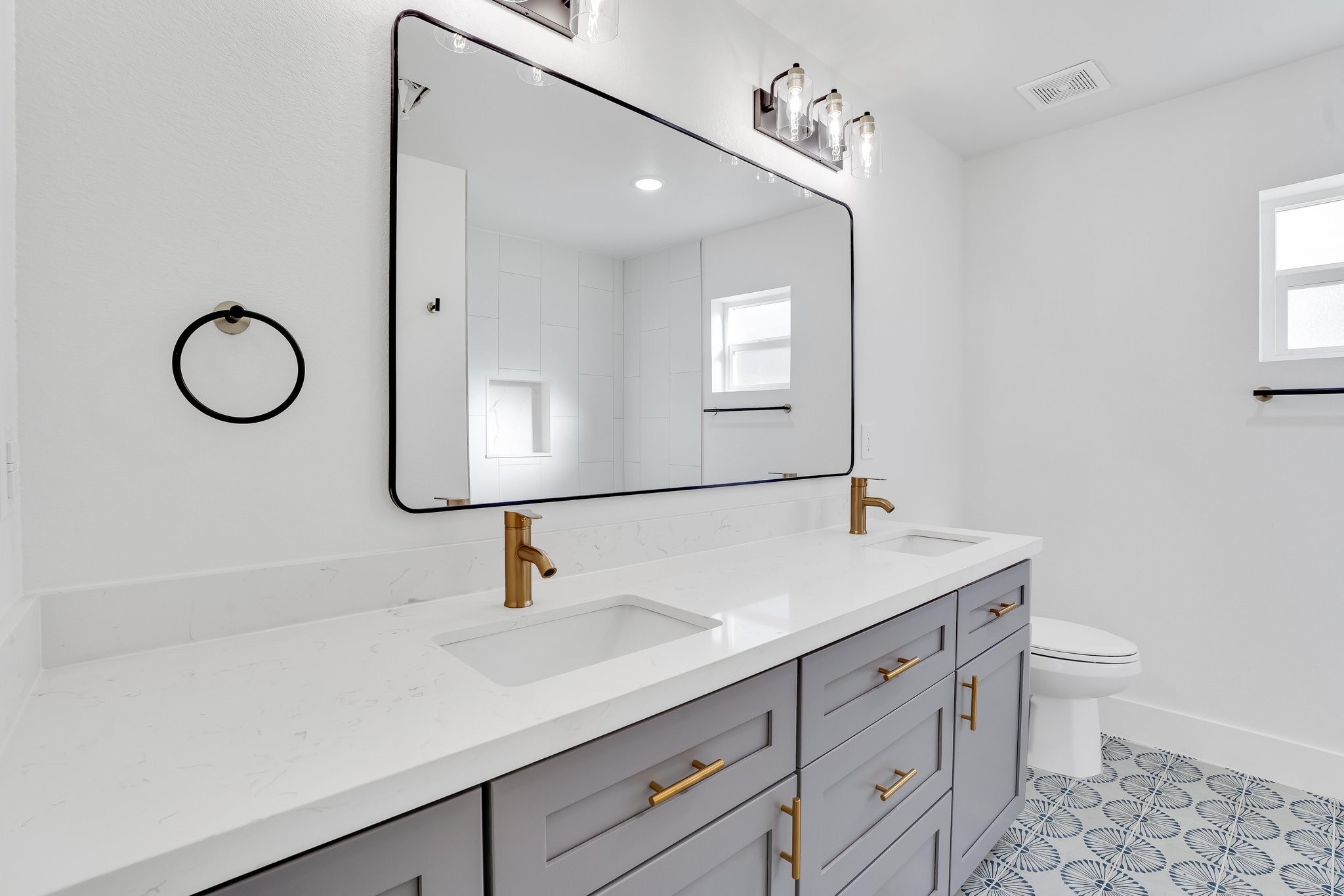 6123 Tuskegee Street Houston, TX 77091 - Photo 5 of 13 a bathroom with a sink vanity granite and a mirror