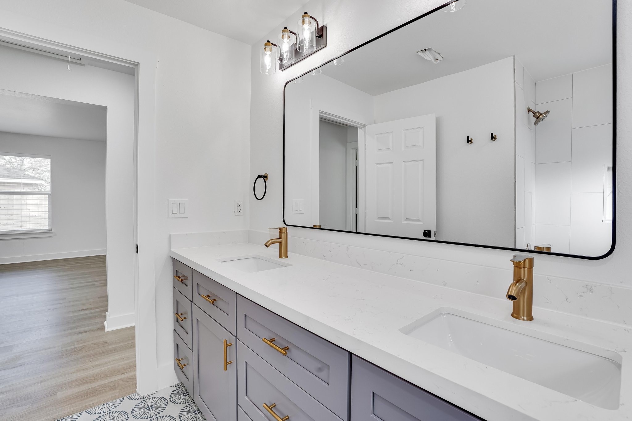 6123 Tuskegee Street Houston, TX 77091 - Photo 7 of 13 a bathroom with a sink and a mirror