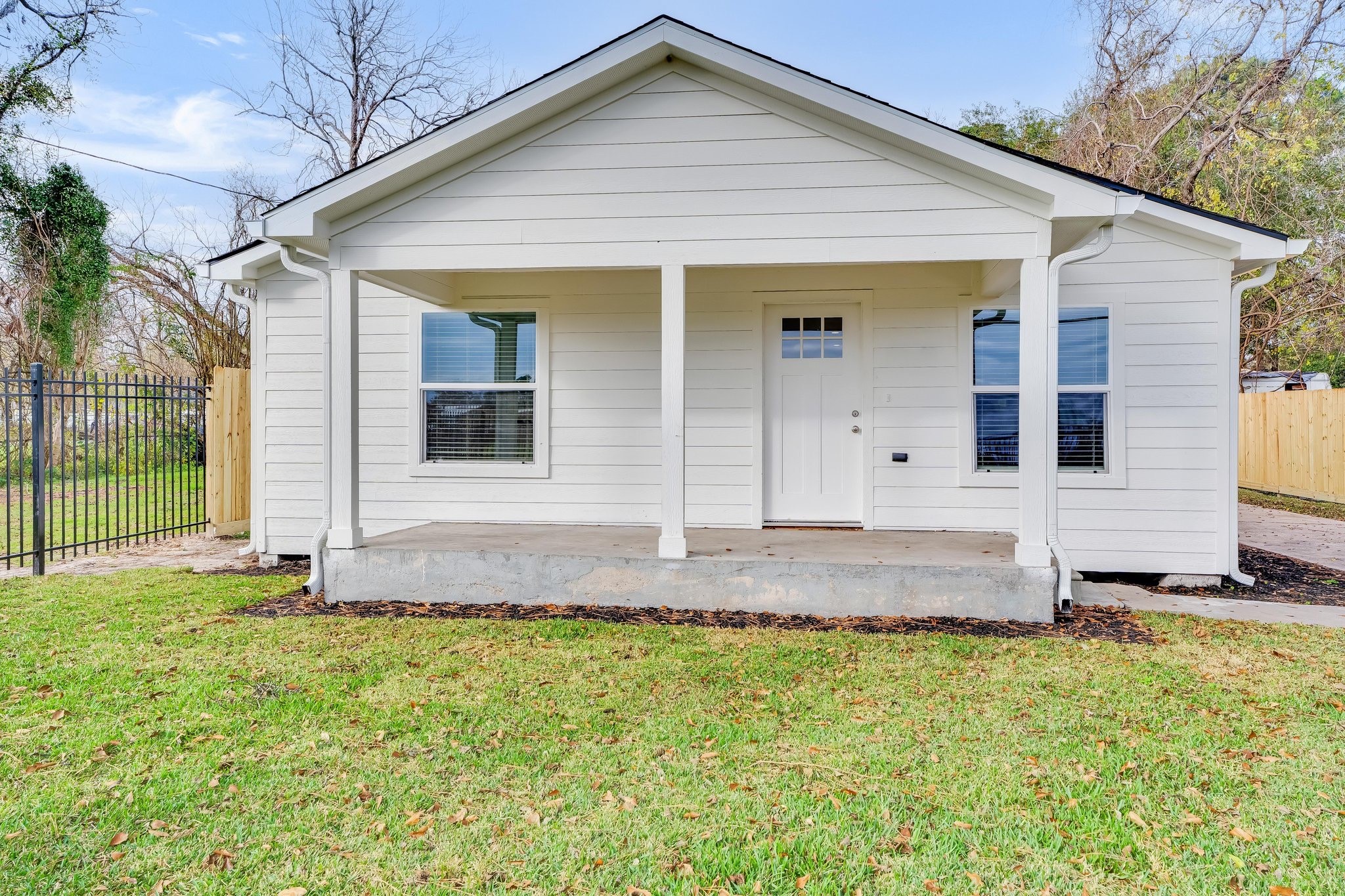 6123 Tuskegee Street Houston, TX 77091 - Photo 10 of 13 a front view of a house with a yard