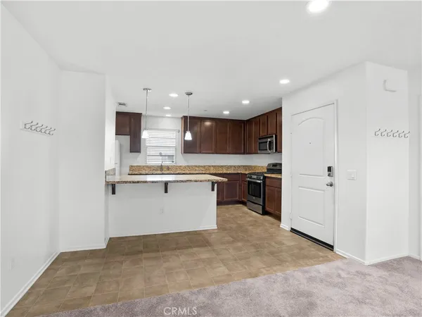 a kitchen with a refrigerator and a sink