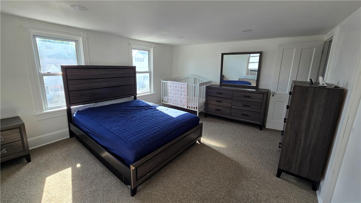 883 North Locust Street Hazleton, PA 18201 - Photo 45 of 83 Natural light floods this spacious bedroom, offering an ideal setting for tranquil rest and relaxation.