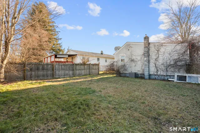 a view of a back yard of the house