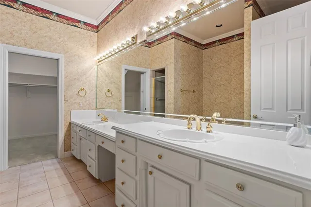 a spacious bathroom with a double vanity sink mirror and double
