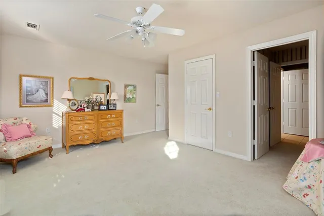 a bedroom with furniture and window