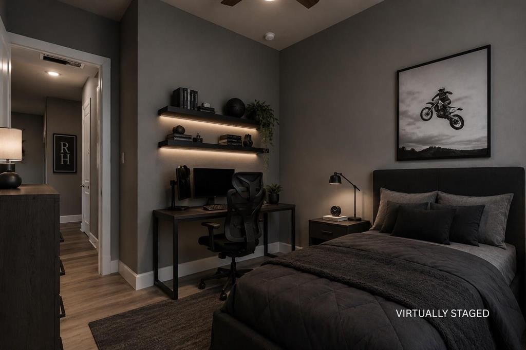 3721 Prickly Pear Road Little Elm, TX 75068 - Photo 13 of 21 Bedroom featuring wood-finish flooring, built-in shelving with integrated lighting, a ceiling fan, and white trim