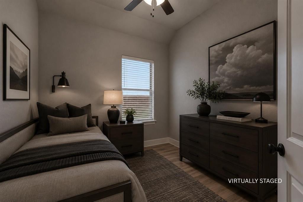 3721 Prickly Pear Road Little Elm, TX 75068 - Photo 14 of 21 Recessed window with blinds, wood-finish flooring, ceiling fan with integrated lighting, wall-mounted light fixture, and a solid core door