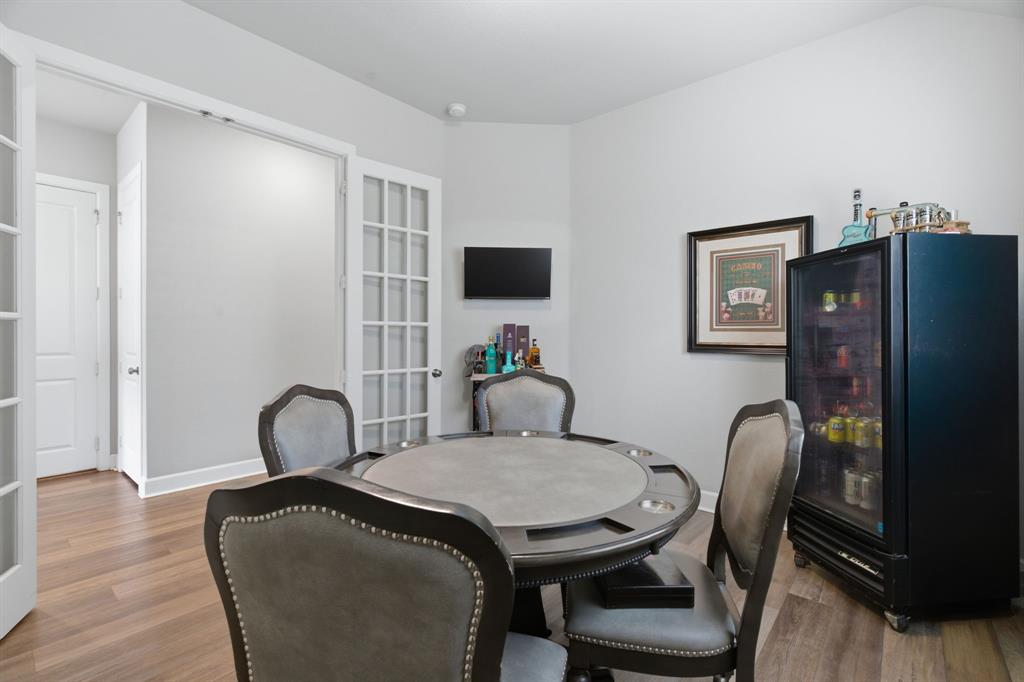 3721 Prickly Pear Road Little Elm, TX 75068 - Photo 5 of 21 Room featuring wood-finish flooring, light gray walls, and white crown molding
