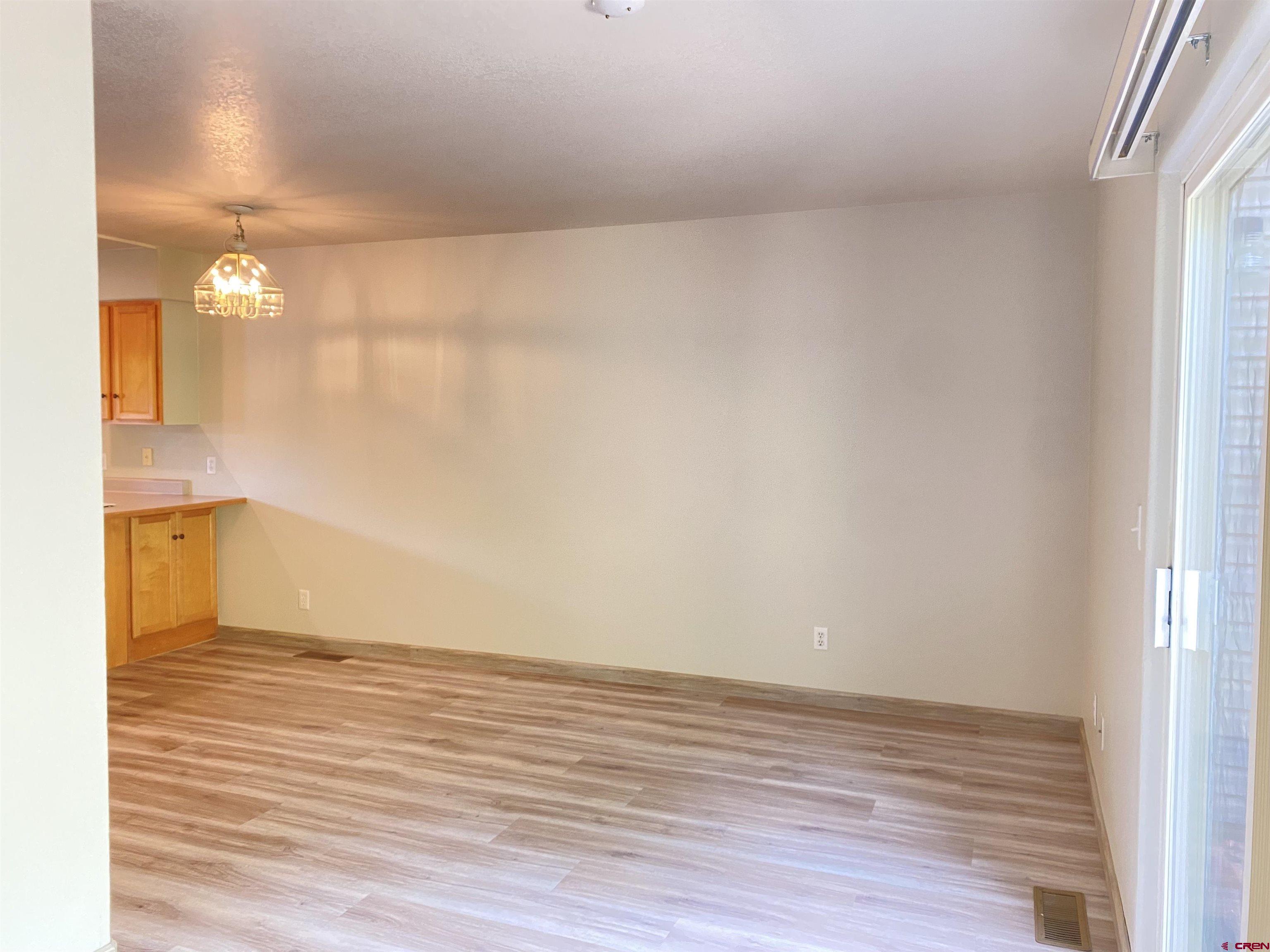 33 Sunridge Lane Durango, CO 81301 - Photo 11 of 37 a view of an empty room with wooden floor