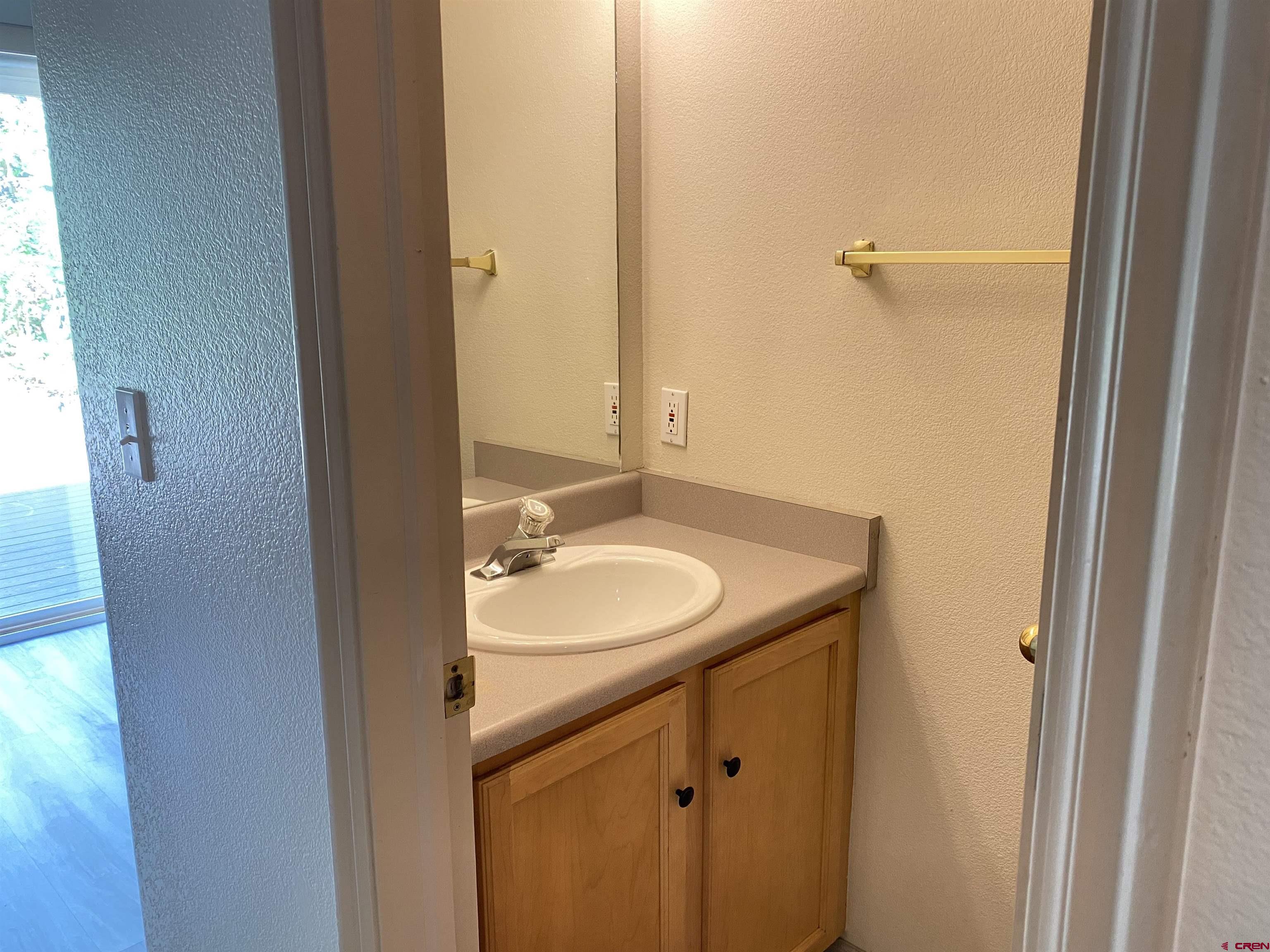 33 Sunridge Lane Durango, CO 81301 - Photo 13 of 37 a bathroom with a sink and a mirror