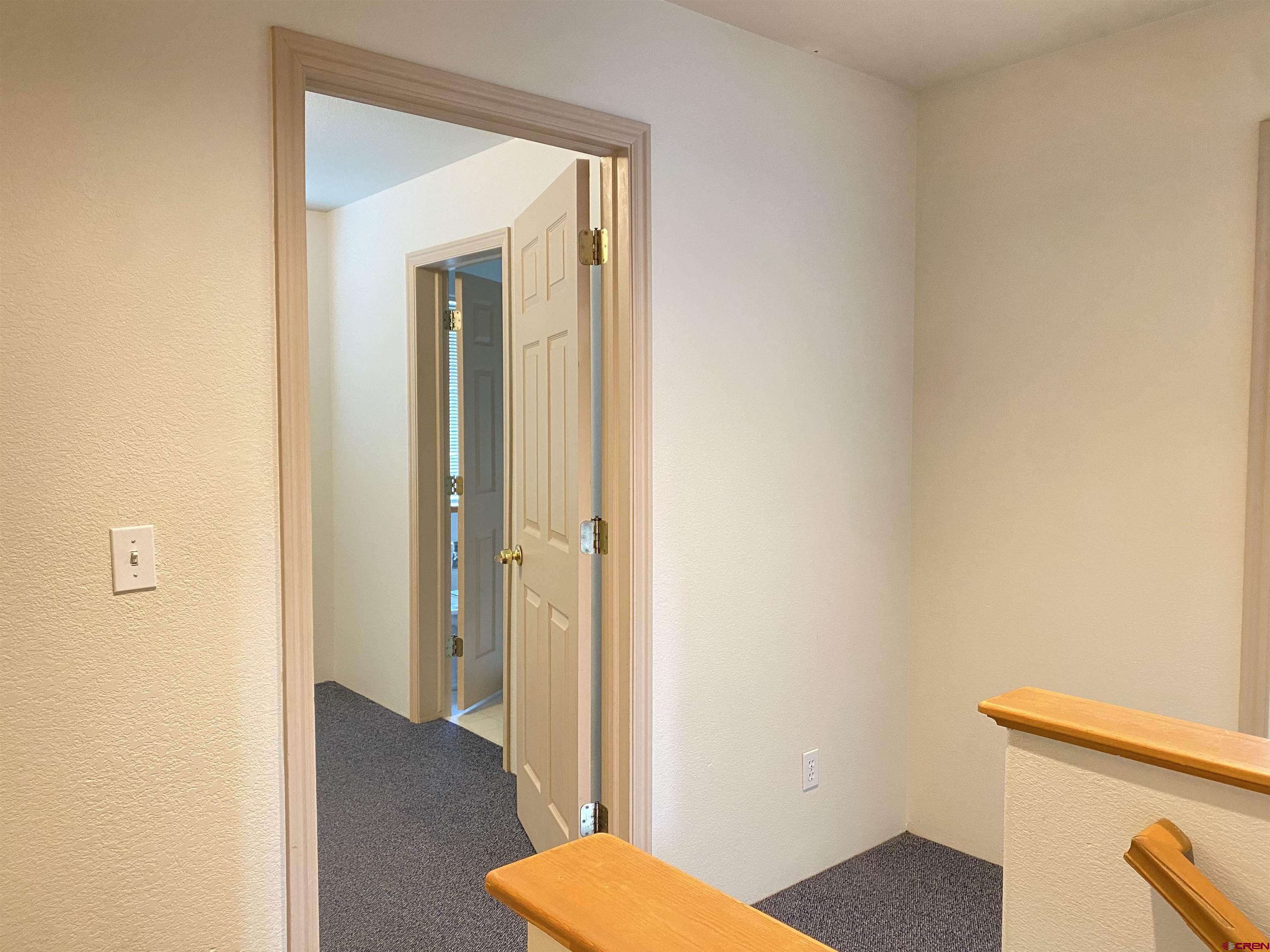 33 Sunridge Lane Durango, CO 81301 - Photo 15 of 37 a view of a hallway with wooden floor