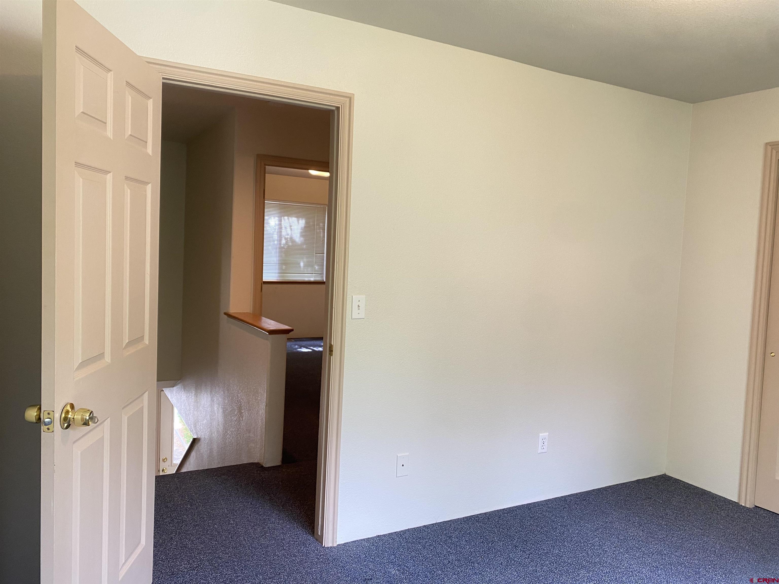 33 Sunridge Lane Durango, CO 81301 - Photo 18 of 37 a view of a hallway view with wooden floor and closet