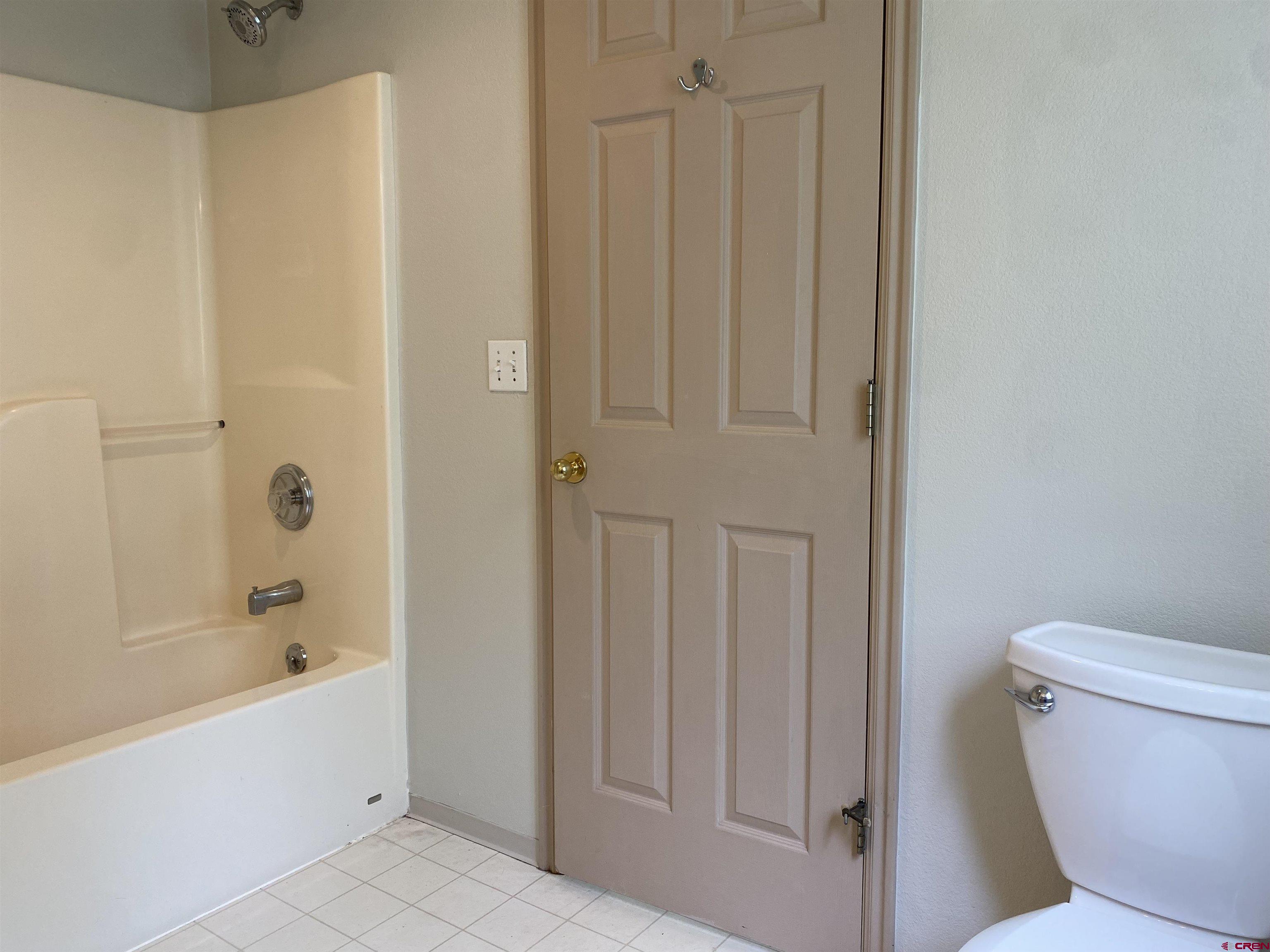33 Sunridge Lane Durango, CO 81301 - Photo 20 of 37 a bathroom with a bathtub and a toilet