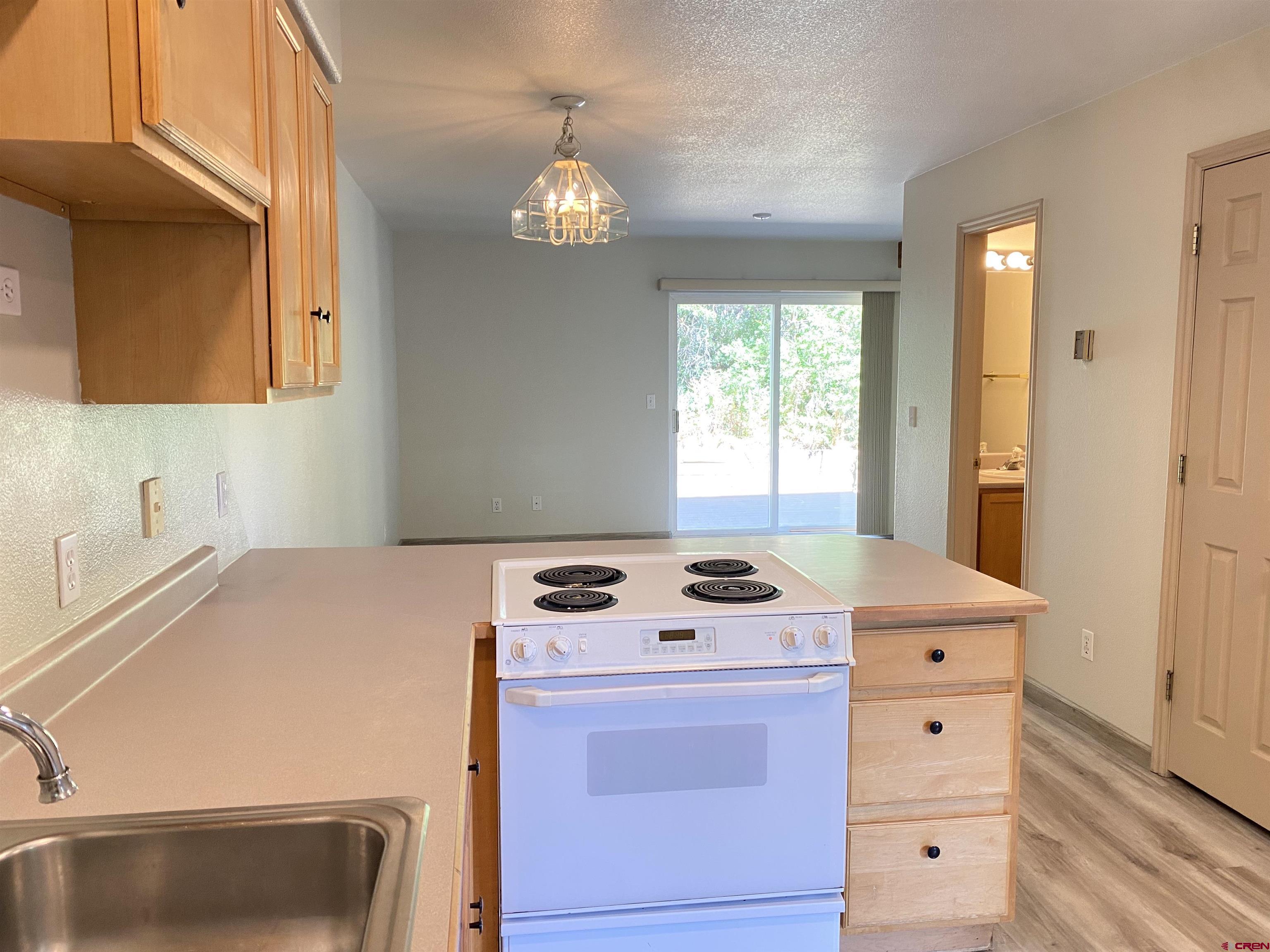 33 Sunridge Lane Durango, CO 81301 - Photo 5 of 37 a kitchen that has a stove and a table