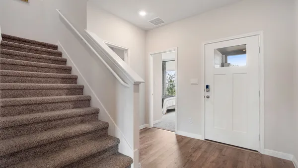 a view of entryway with wooden floor
