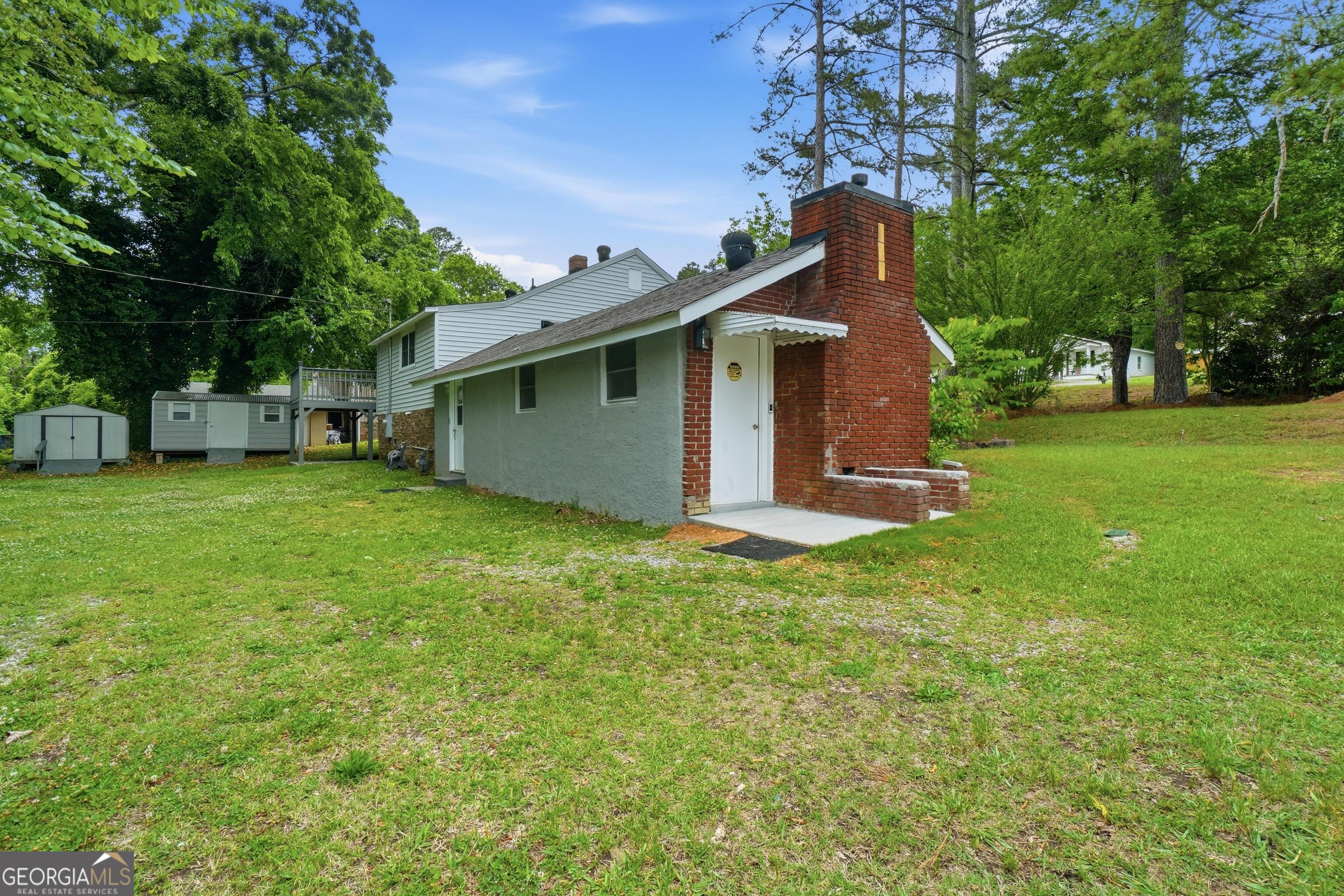 3022 Maple Road Southeast Lindale, GA 30147 - Photo 27 of 29 a front view of a house with a garden