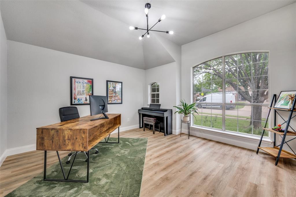 7306 Vista Ridge Lane Sachse, TX 75048 - Photo 2 of 23 a living room with furniture and a floor to ceiling window