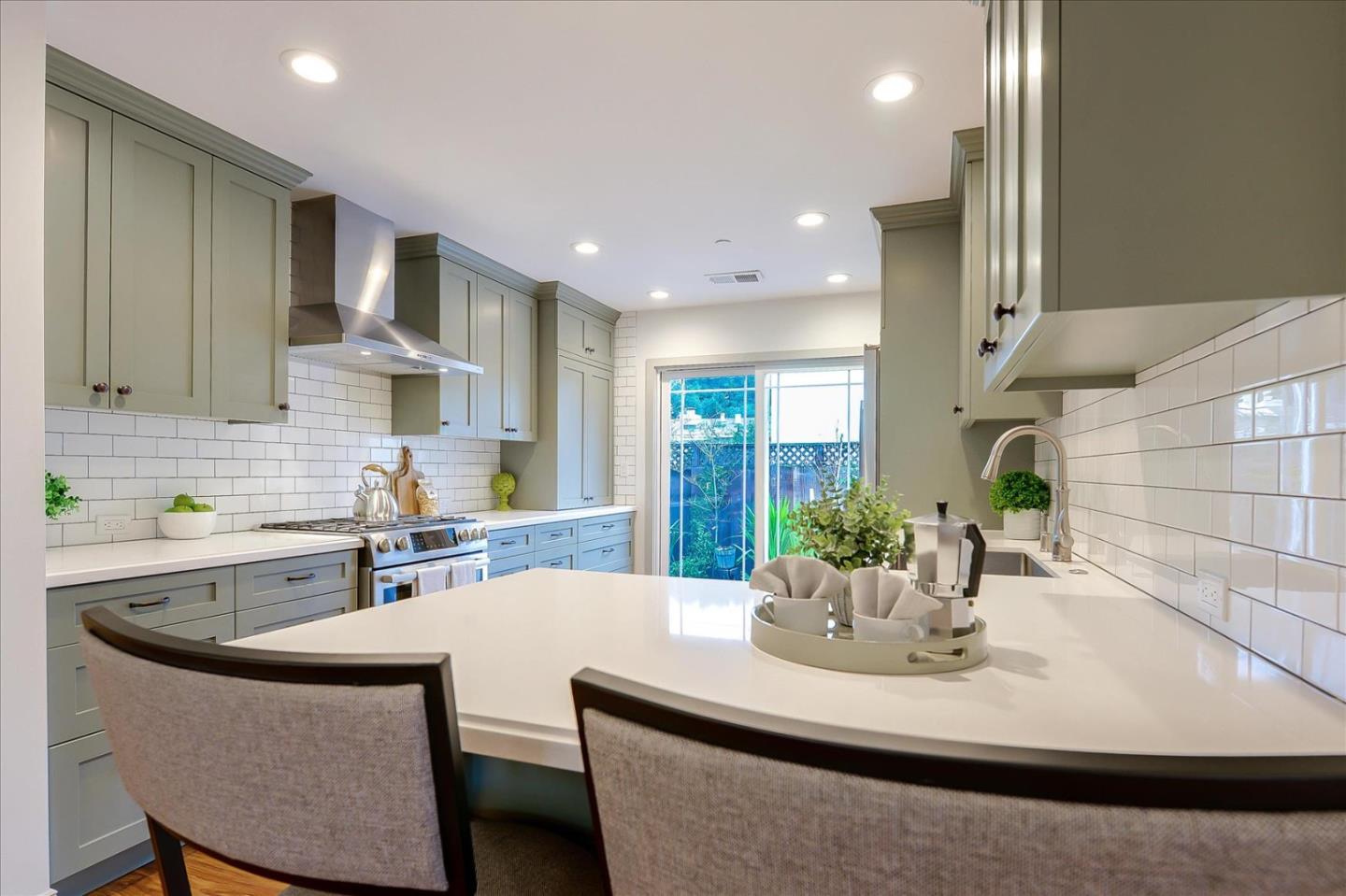 112 Haight Street Menlo Park, CA 94025 - Photo 12 of 47 a kitchen with kitchen island stainless steel appliances a sink and cabinets