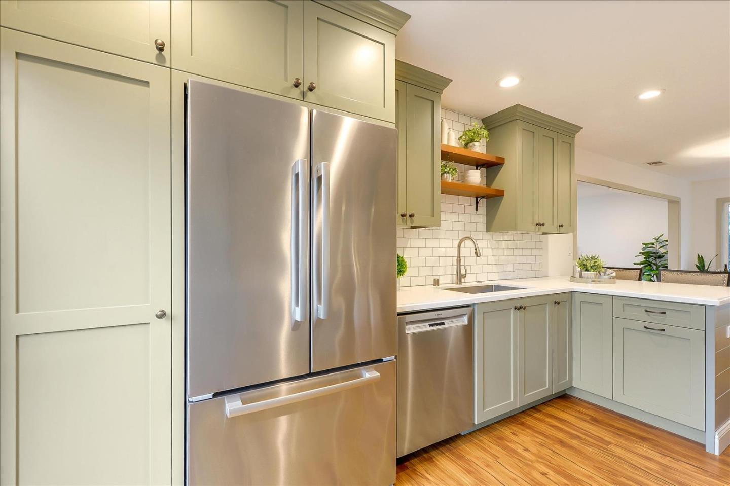 112 Haight Street Menlo Park, CA 94025 - Photo 13 of 47 a kitchen with a refrigerator and a sink