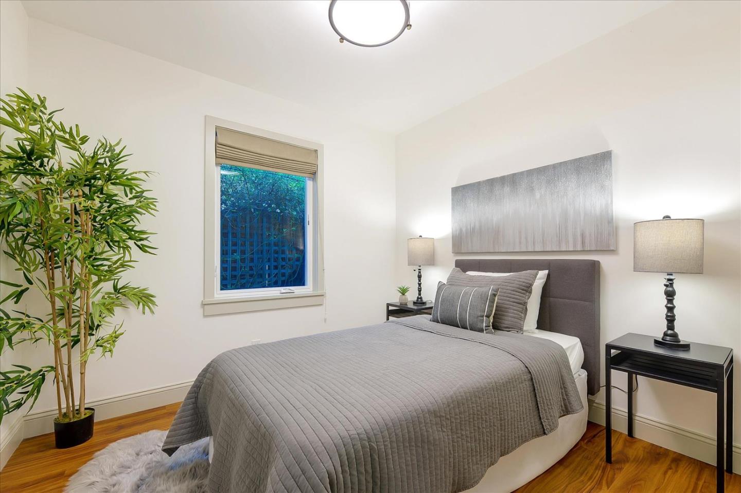 112 Haight Street Menlo Park, CA 94025 - Photo 16 of 47 a bedroom with a bed and a potted plant