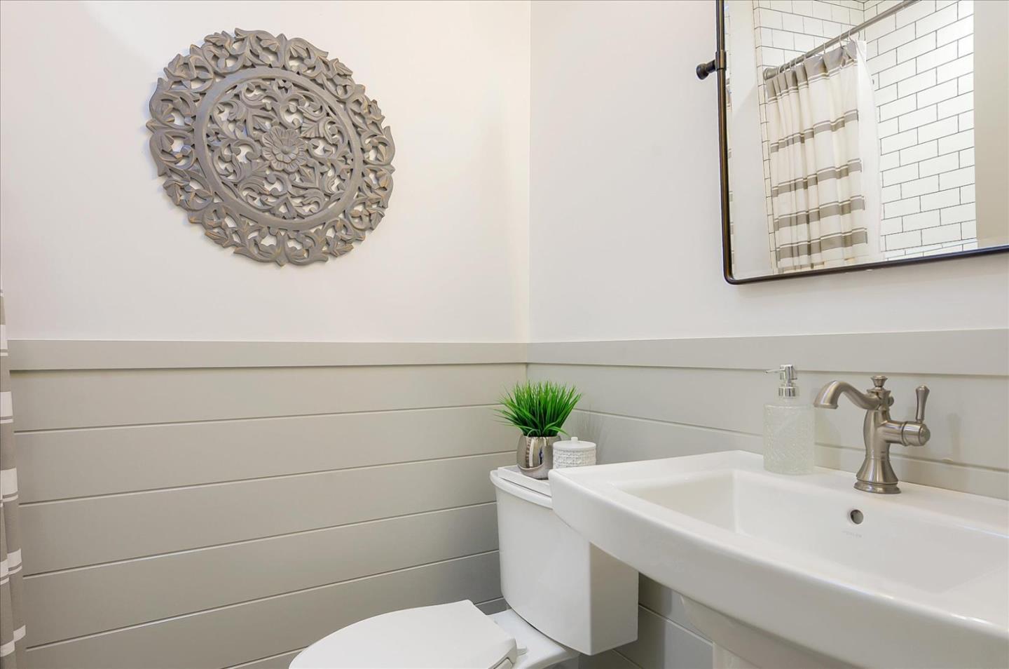 112 Haight Street Menlo Park, CA 94025 - Photo 18 of 47 a bathroom with a sink a mirror and a toilet