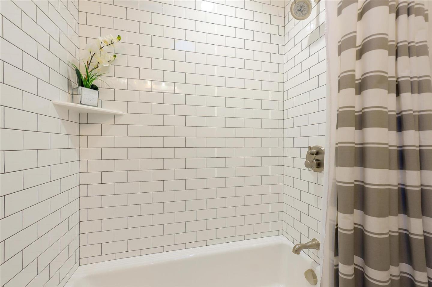 112 Haight Street Menlo Park, CA 94025 - Photo 19 of 47 a bathroom with a bathtub and a shower