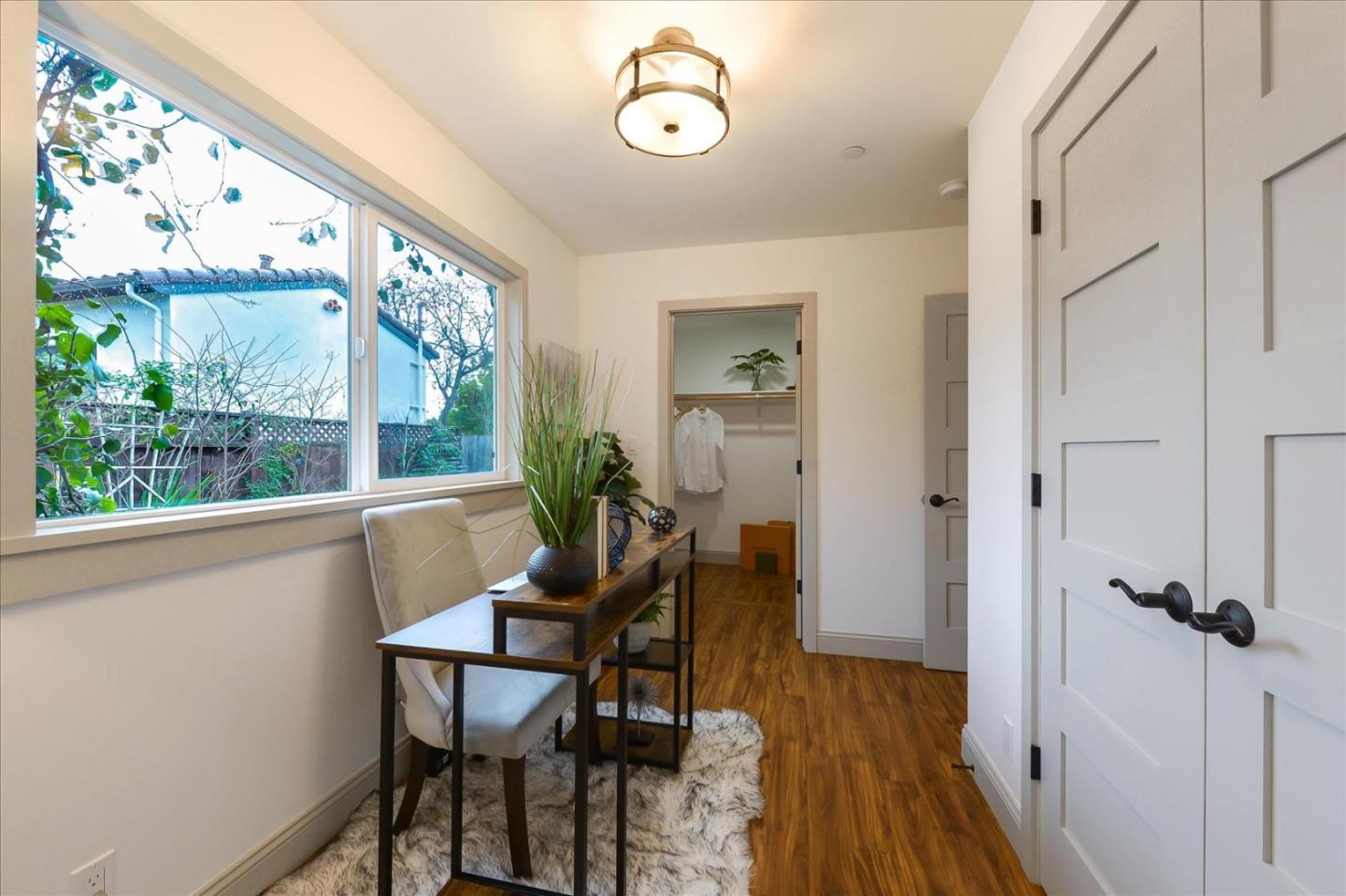 112 Haight Street Menlo Park, CA 94025 - Photo 21 of 47 a view of a room with furniture window and wooden floor