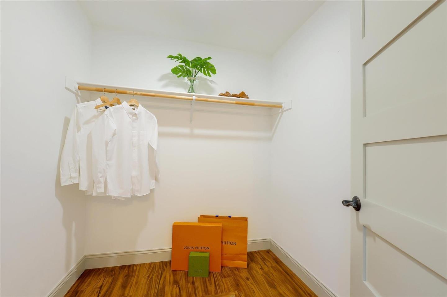 112 Haight Street Menlo Park, CA 94025 - Photo 22 of 47 a view of a bedroom with a bed and hardwood floor