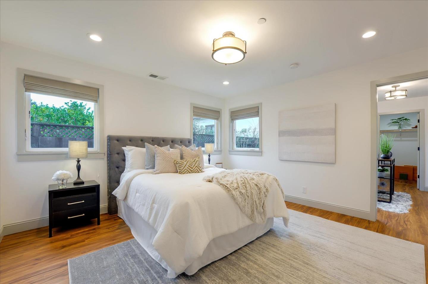 112 Haight Street Menlo Park, CA 94025 - Photo 23 of 47 a bedroom with a bed and a lamp