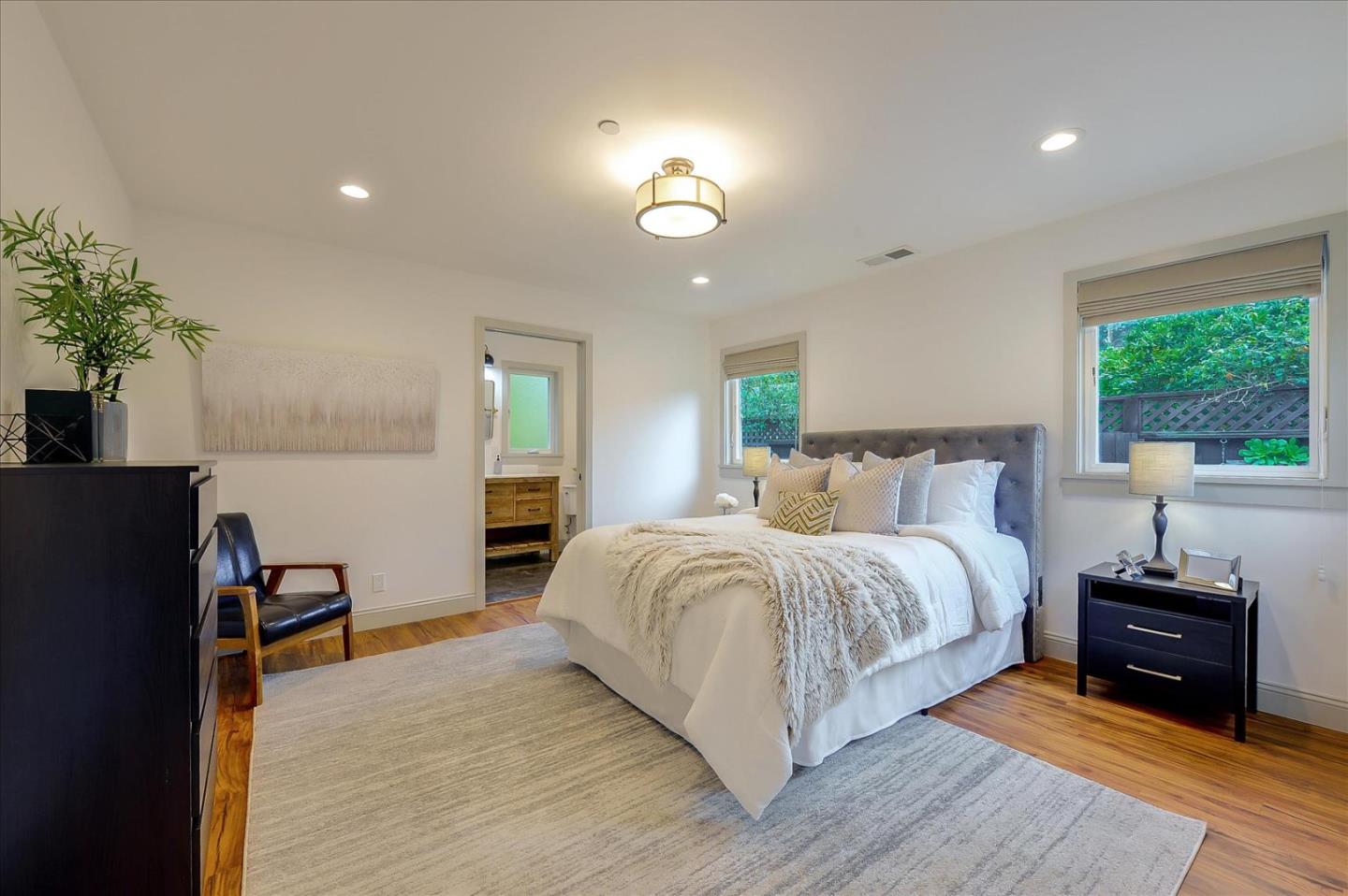 112 Haight Street Menlo Park, CA 94025 - Photo 24 of 47 a spacious bedroom with a bed and a couch