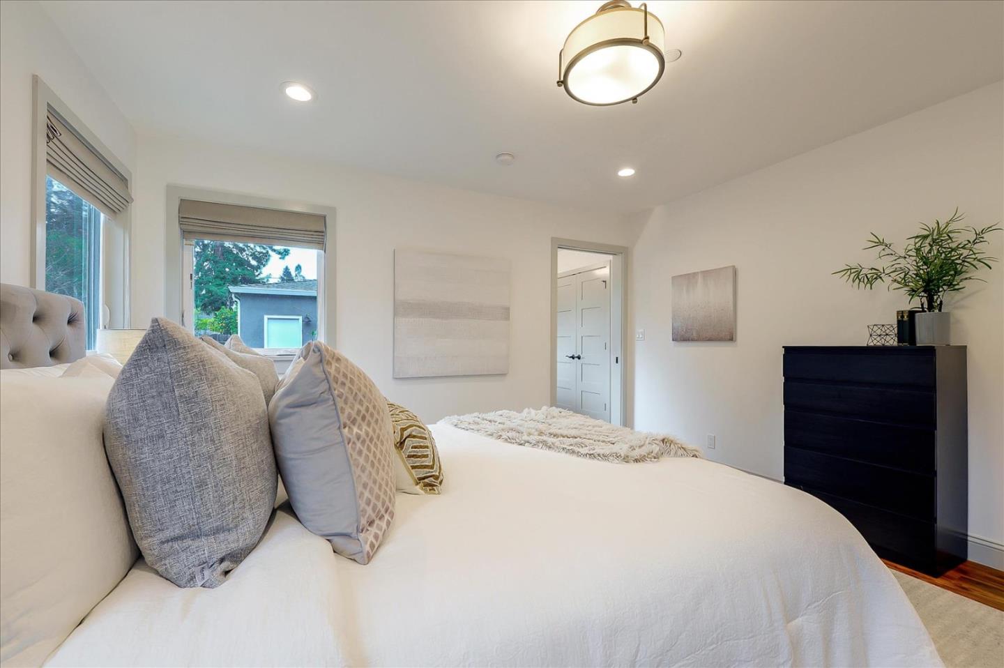 112 Haight Street Menlo Park, CA 94025 - Photo 25 of 47 a bedroom with a large bed and a dresser