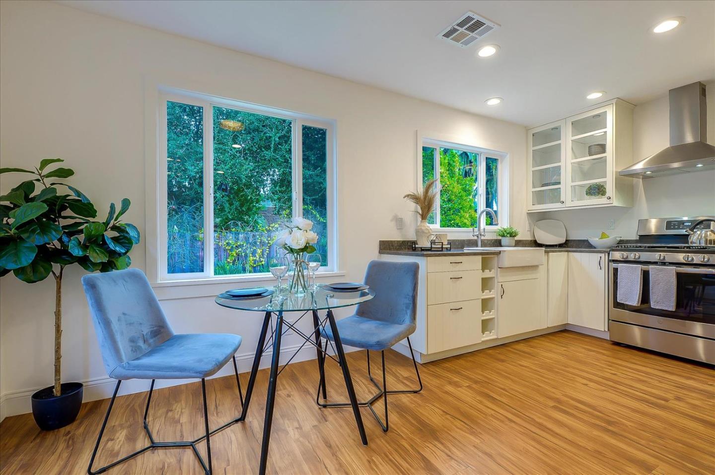 112 Haight Street Menlo Park, CA 94025 - Photo 31 of 47 a kitchen with a table chairs stove and wooden floor
