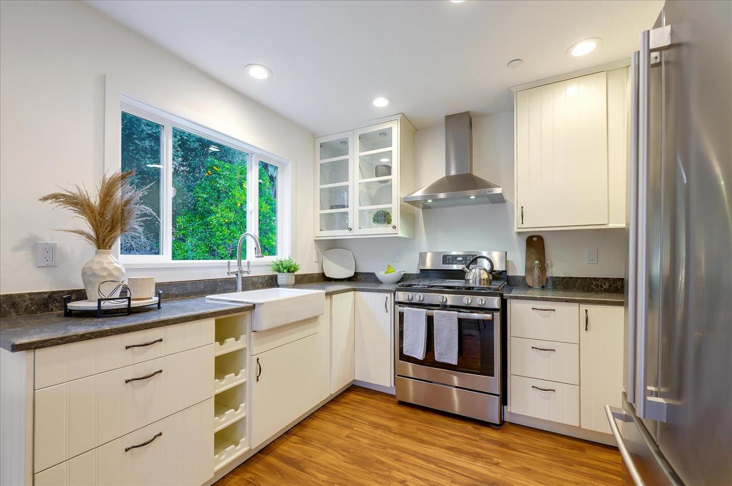 112 Haight Street Menlo Park, CA 94025 - Photo 33 of 47 a kitchen with stainless steel appliances granite countertop a stove and a sink