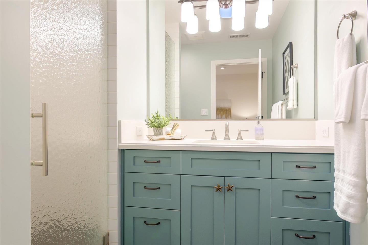 112 Haight Street Menlo Park, CA 94025 - Photo 36 of 47 a bathroom with a sink and a mirror