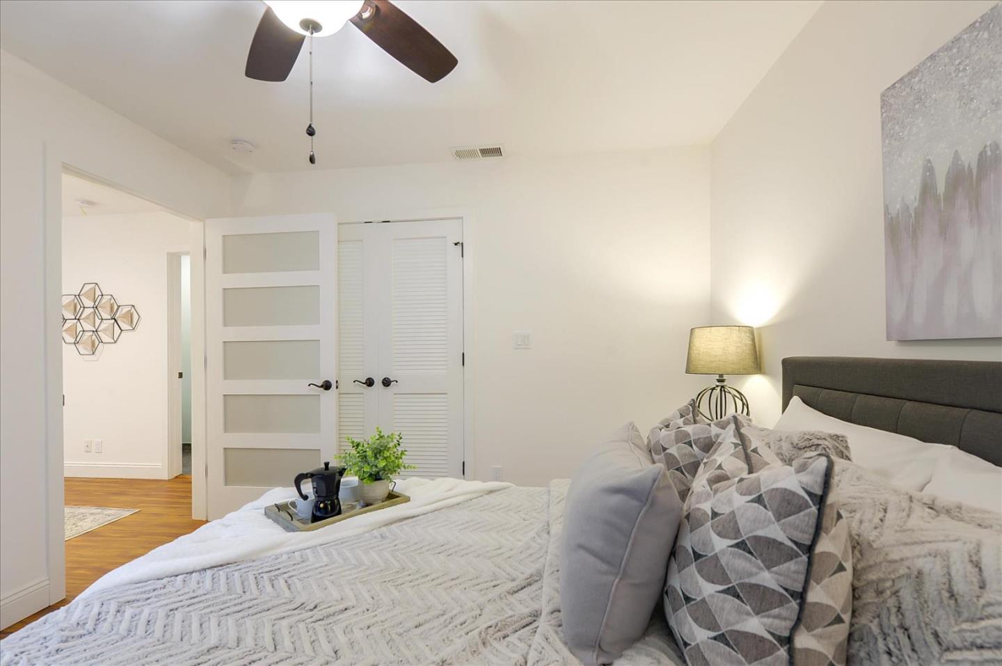 112 Haight Street Menlo Park, CA 94025 - Photo 38 of 47 a bedroom with a bed and a chandelier