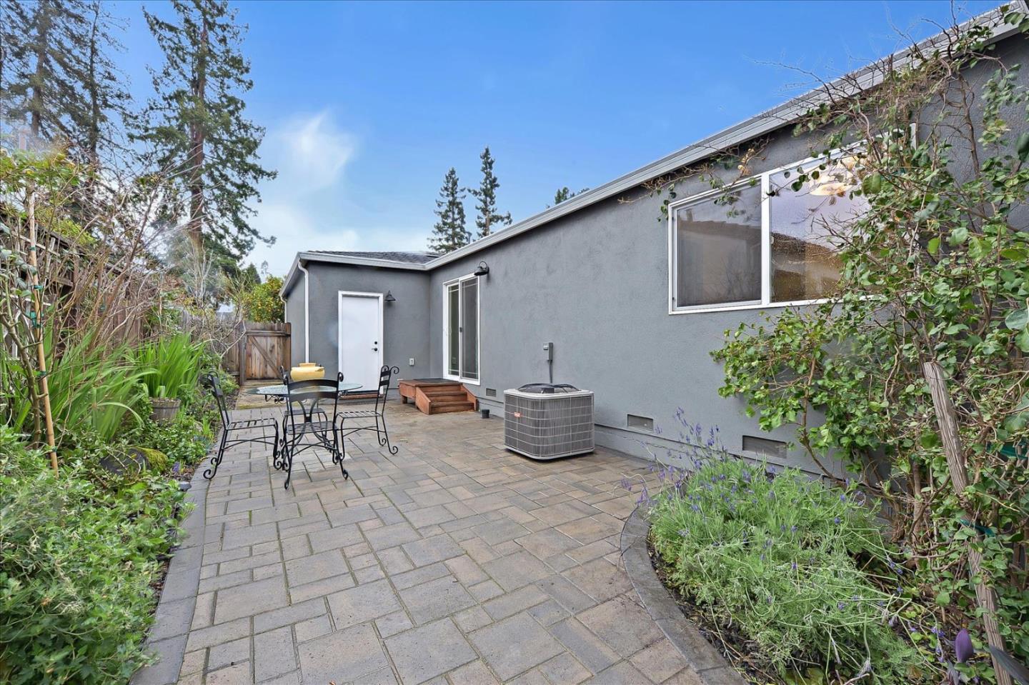 112 Haight Street Menlo Park, CA 94025 - Photo 43 of 47 a view of a patio with table and chairs and potted plants